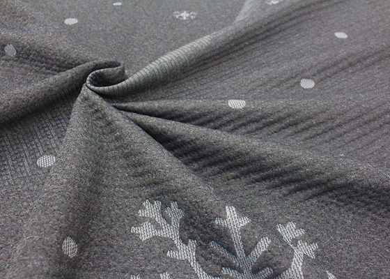 il jacquard fine 100% del poliestere ha tricottato il modello del fiocco di neve del tessuto del materasso